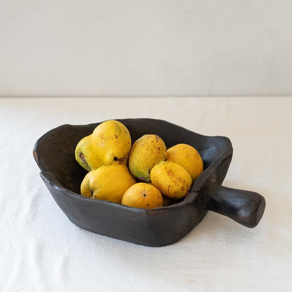 The Camphor Wood Fruit Handled Tray, Home (14 x 9 x 11 in), filled with yellow quinces, sits on a white tablecloth against a light background.